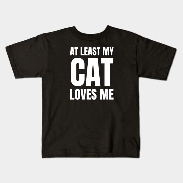 At least my cat loves me Kids T-Shirt by InspiredCreative